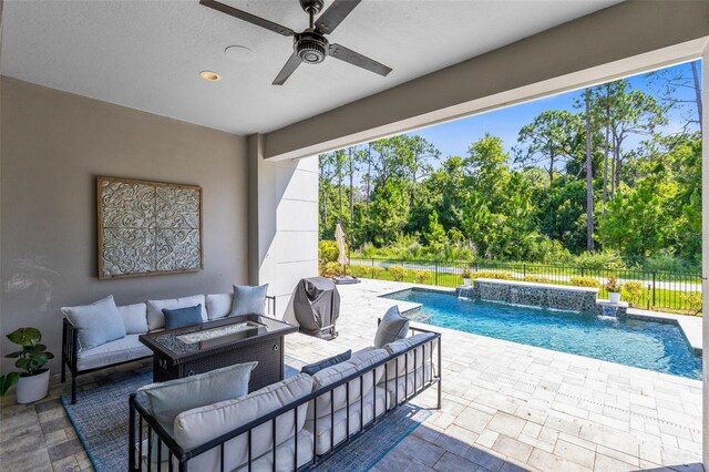 view of patio with pool water feature, ceiling fan, a grill, an outdoor hangout area, and a fenced in pool