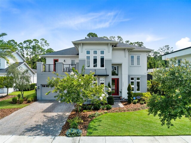 view of front facade with a garage and a front yard