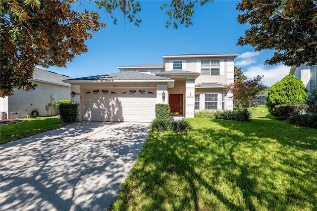 view of front facade with a front lawn and a garage