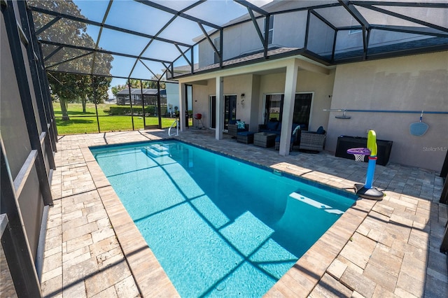 view of pool featuring a lanai, an outdoor hangout area, and a patio