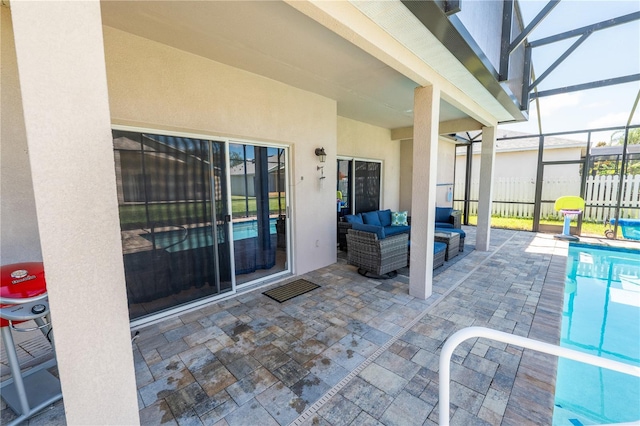 view of patio with outdoor lounge area, a fenced in pool, and a lanai