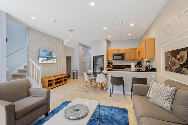 living room with light tile patterned flooring