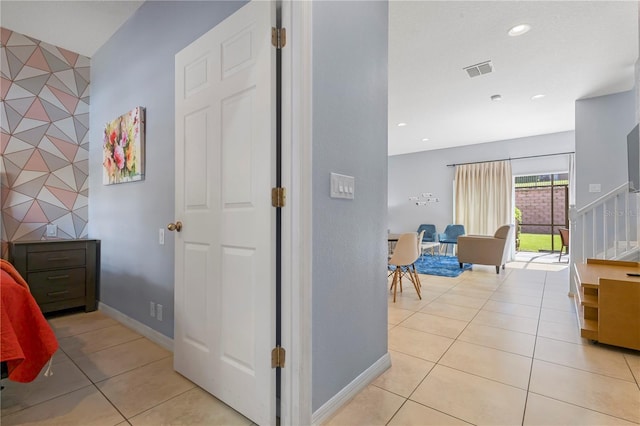 hall with light tile patterned flooring