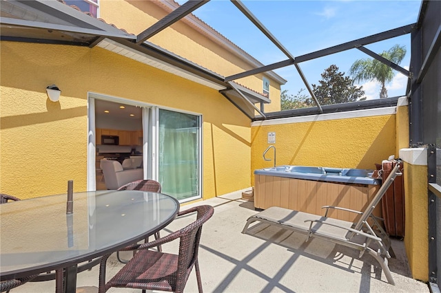 view of patio / terrace featuring a lanai