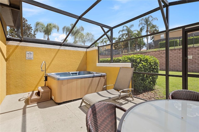 view of patio / terrace with a lanai