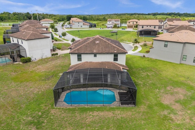 view of swimming pool with glass enclosure