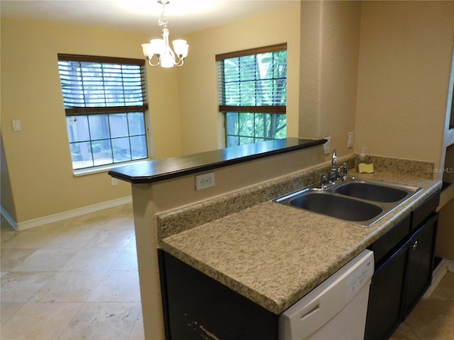 kitchen with dishwasher, pendant lighting, sink, white cabinetry, and kitchen peninsula