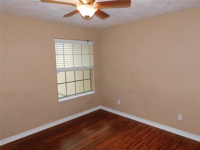 spare room with hardwood / wood-style flooring, ceiling fan, and a textured ceiling