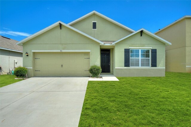 single story home with a garage and a front lawn