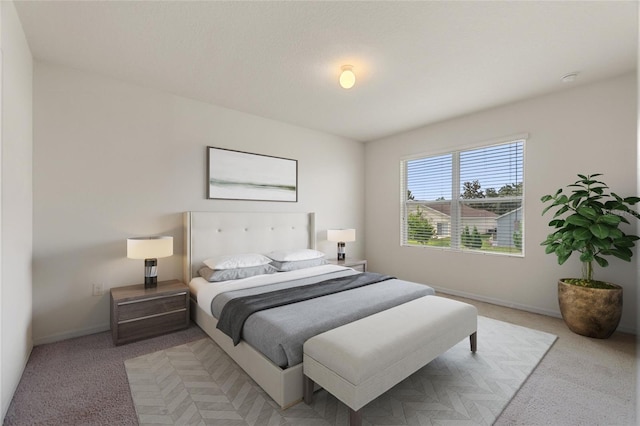 bedroom featuring light carpet