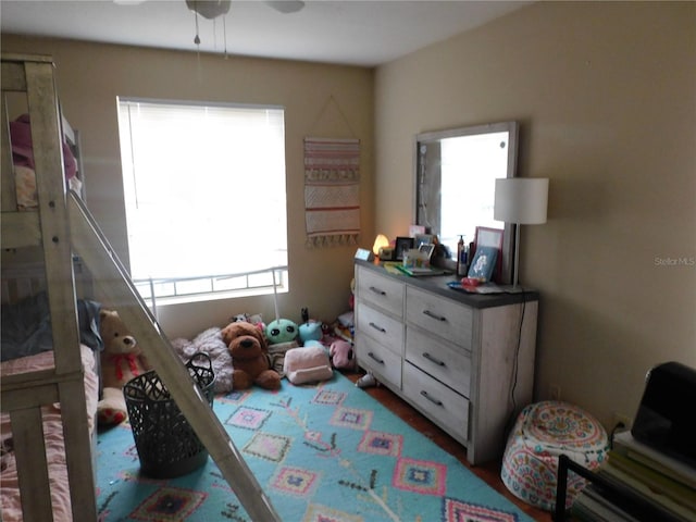 bedroom featuring multiple windows and ceiling fan