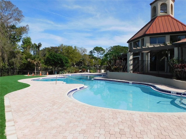 view of pool featuring a patio