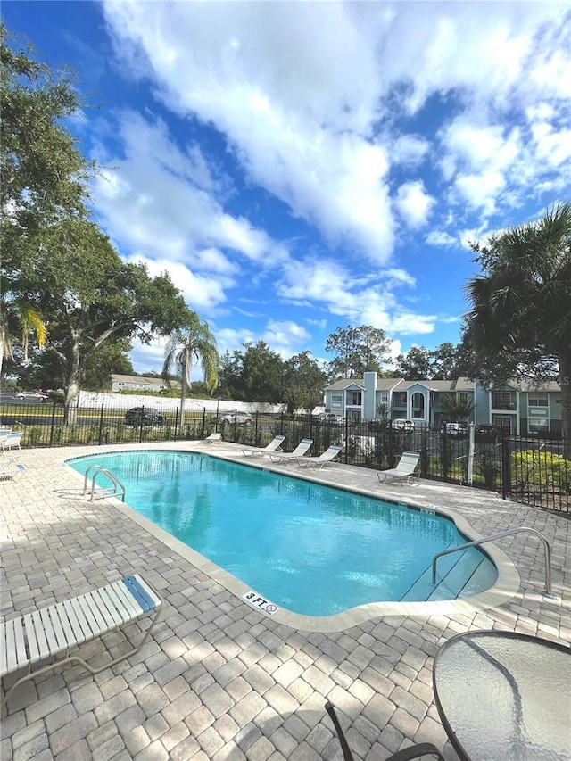 view of pool featuring a patio area