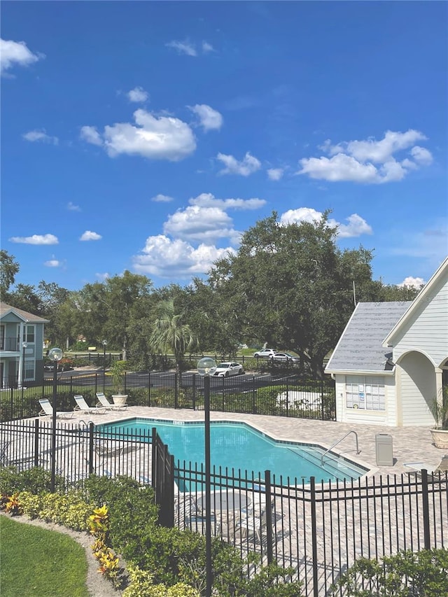 view of swimming pool featuring a patio