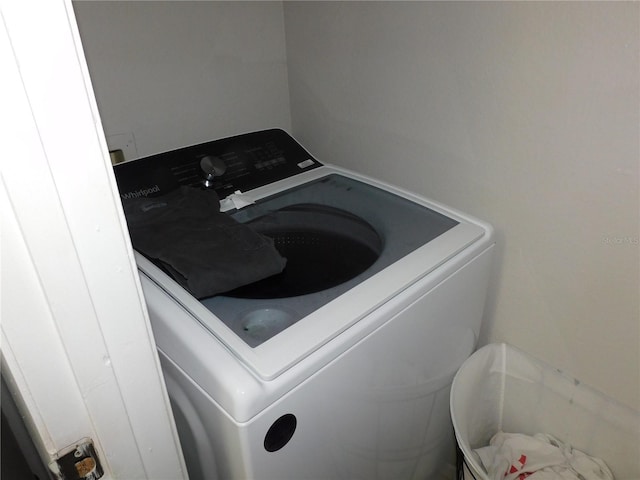 clothes washing area featuring washer / dryer