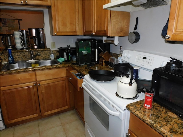 kitchen featuring dark stone countertops, electric stove, sink, ventilation hood, and light tile patterned floors