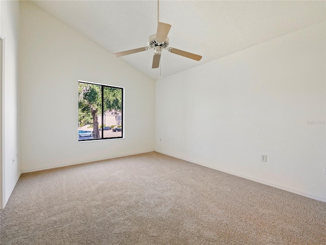 carpeted empty room featuring high vaulted ceiling and ceiling fan