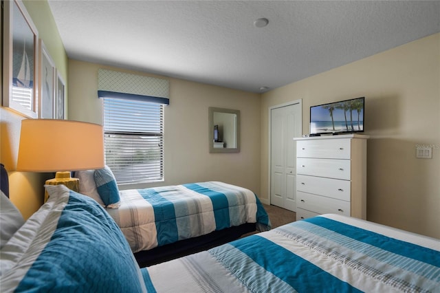 bedroom featuring a textured ceiling