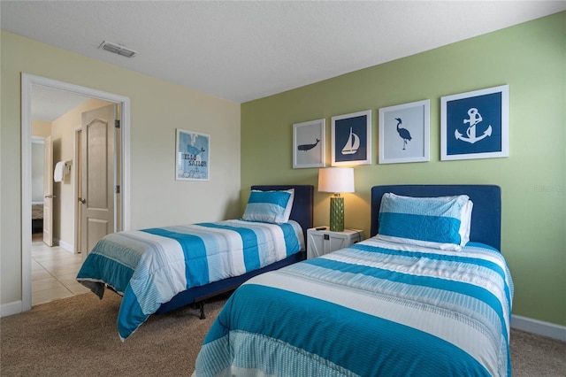 bedroom featuring light colored carpet