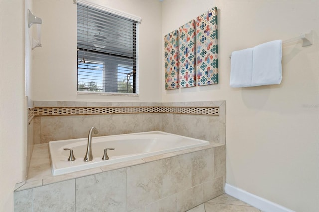 bathroom featuring tile patterned flooring and tiled tub