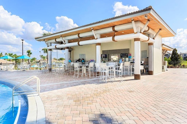 surrounding community with a patio area