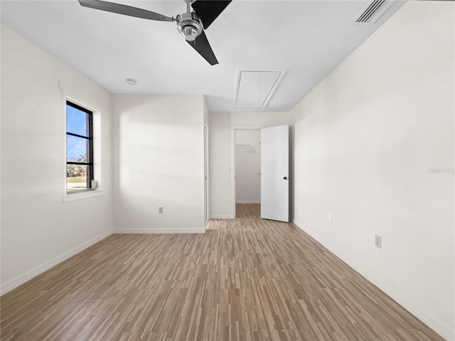 unfurnished room featuring light wood-type flooring and ceiling fan