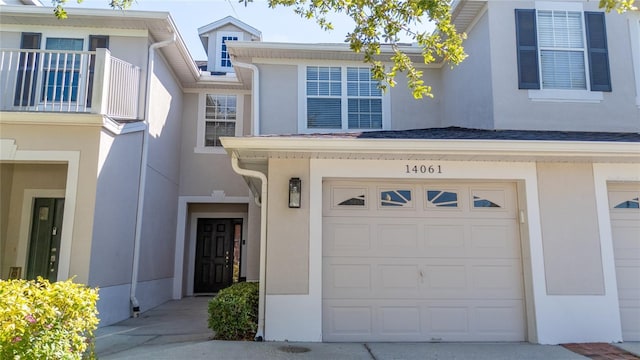 view of exterior entry featuring a garage