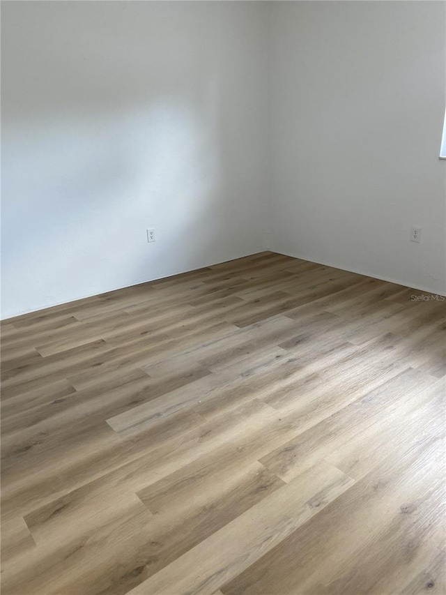 spare room featuring hardwood / wood-style floors