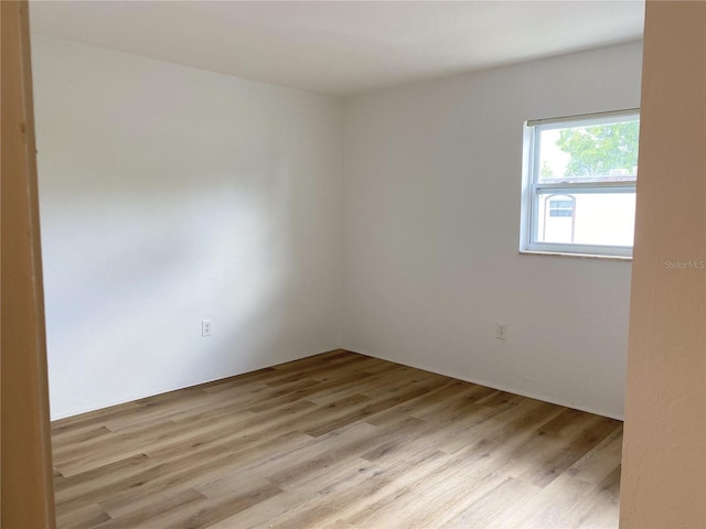 spare room featuring light hardwood / wood-style floors