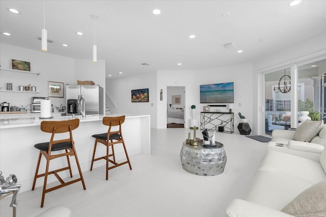 living room featuring an inviting chandelier