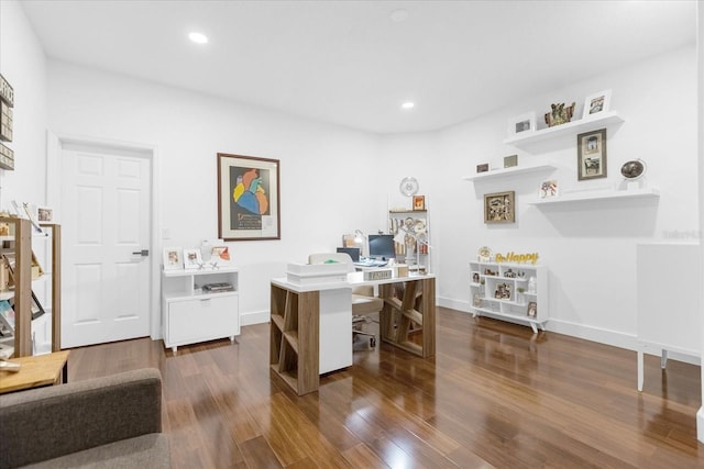 home office with dark hardwood / wood-style flooring