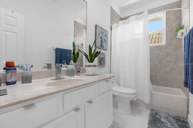 full bathroom featuring toilet, vanity, tile patterned floors, and shower / bath combo with shower curtain