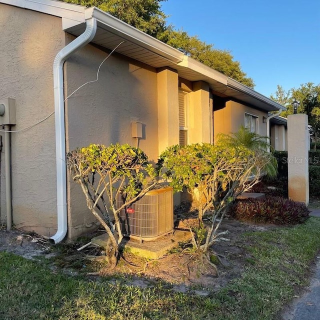 view of property exterior with central AC