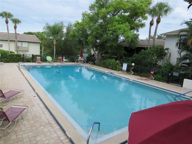 view of pool featuring a patio