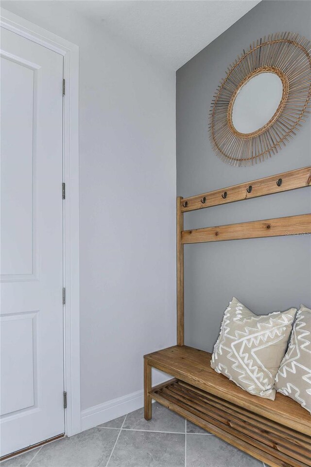 mudroom with light tile patterned floors