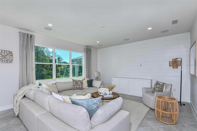 living room with light tile patterned flooring