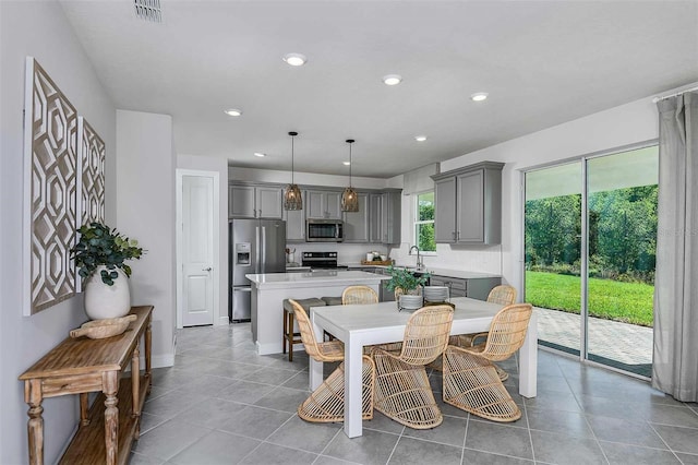 dining area with light tile patterned flooring