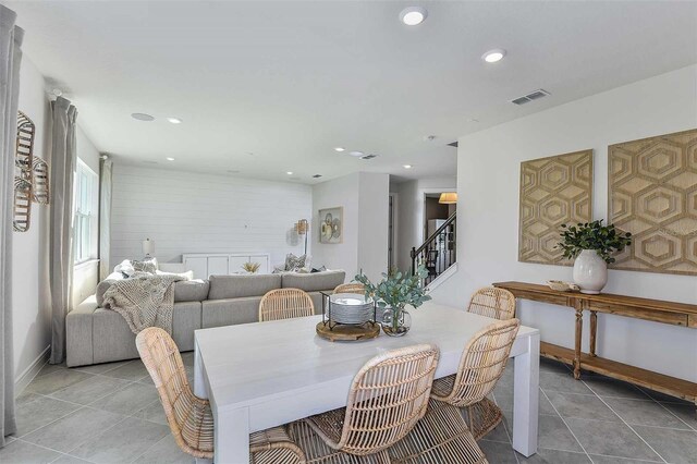 dining space featuring light tile patterned flooring