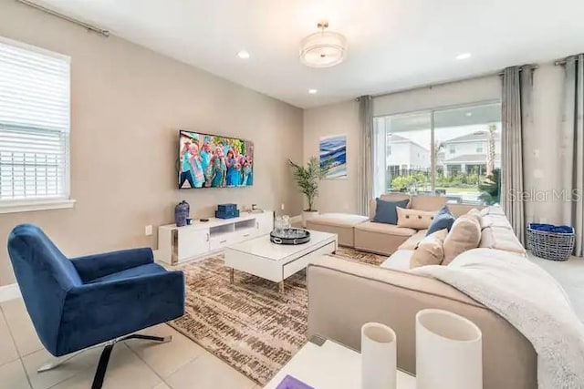 tiled living room featuring plenty of natural light