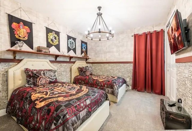 carpeted bedroom featuring a chandelier