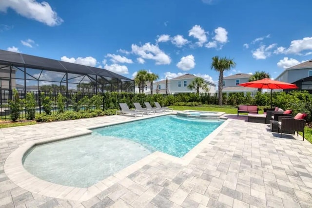 view of swimming pool with a lanai, a patio area, and an outdoor hangout area