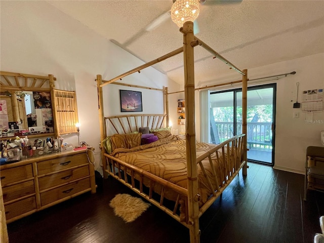 bedroom with a textured ceiling, access to outside, vaulted ceiling, and dark wood-type flooring