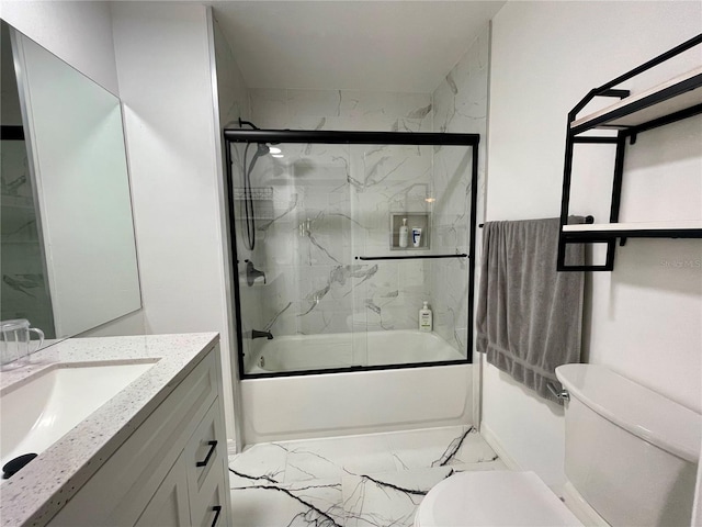 full bathroom featuring vanity, toilet, and bath / shower combo with glass door