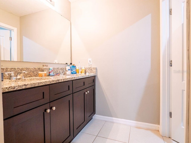 bathroom featuring tile flooring and vanity