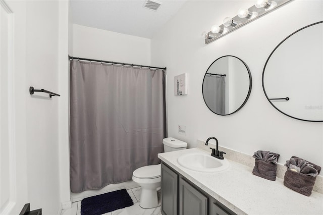 bathroom featuring vanity, toilet, and a shower with shower curtain