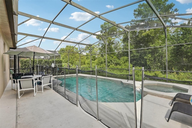 view of swimming pool with an in ground hot tub, a lanai, and a patio area