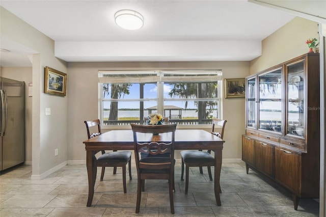 dining area featuring tile flooring