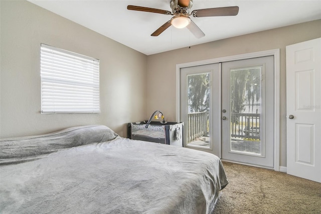 bedroom featuring access to exterior, multiple windows, and carpet floors