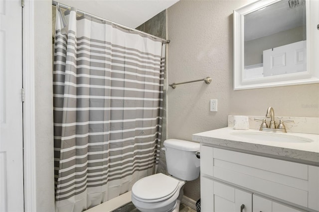 1149 Shady Cove Rd E, Haines City, FL 33844 - full bathroom featuring a textured wall, vanity, toilet, and a shower with shower curtain