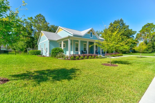 view of property exterior featuring a lawn and covered porch